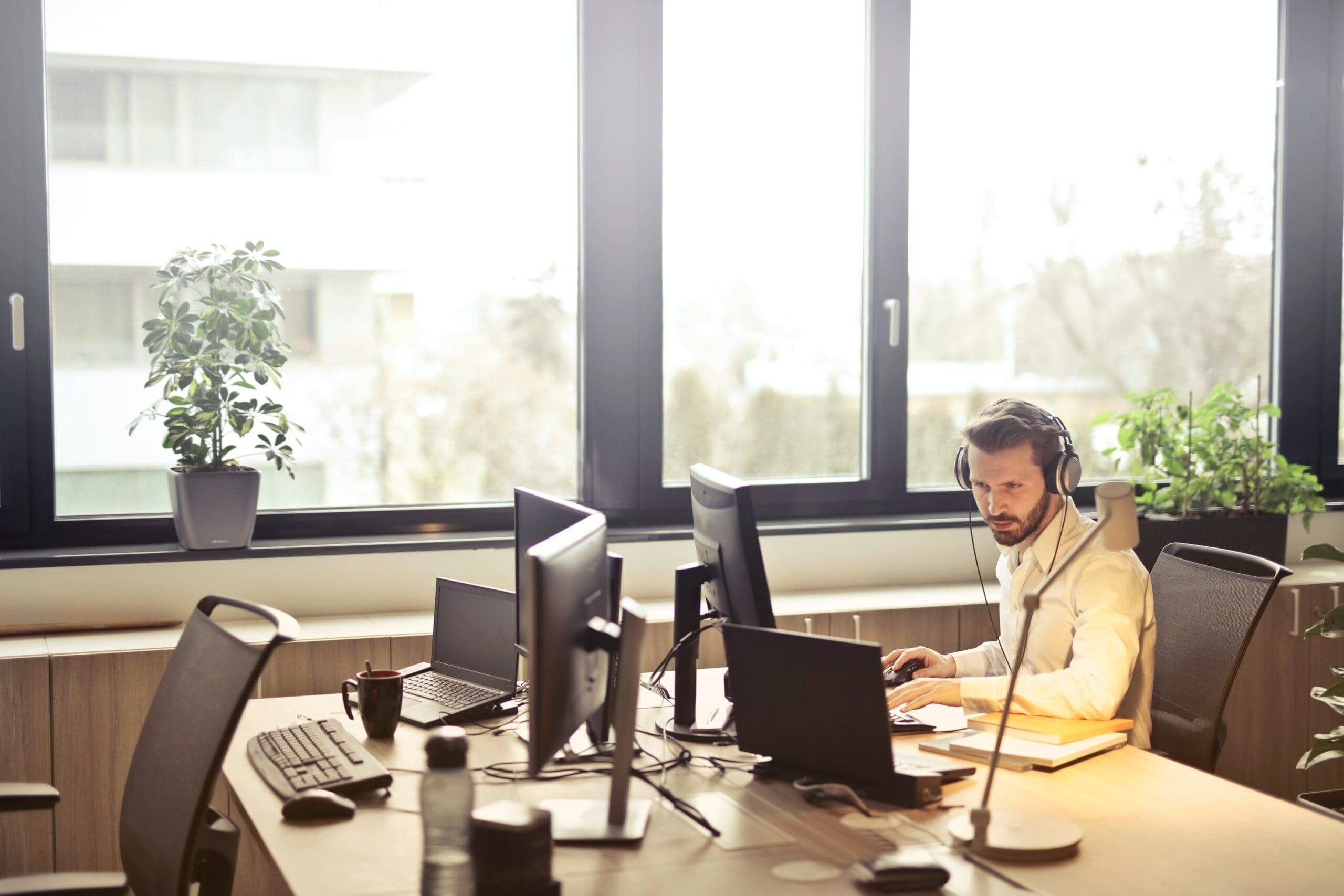 Cyber Liability Insurance Working Employee in Office by Window
